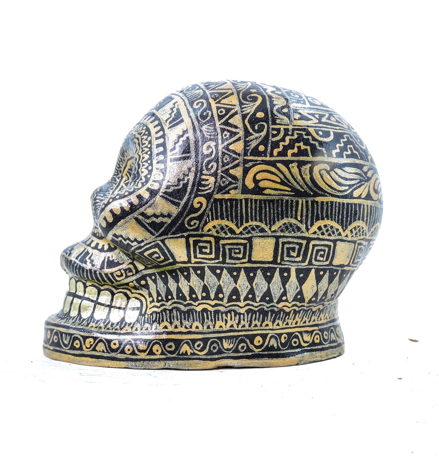 Craneo de Barro Dorado