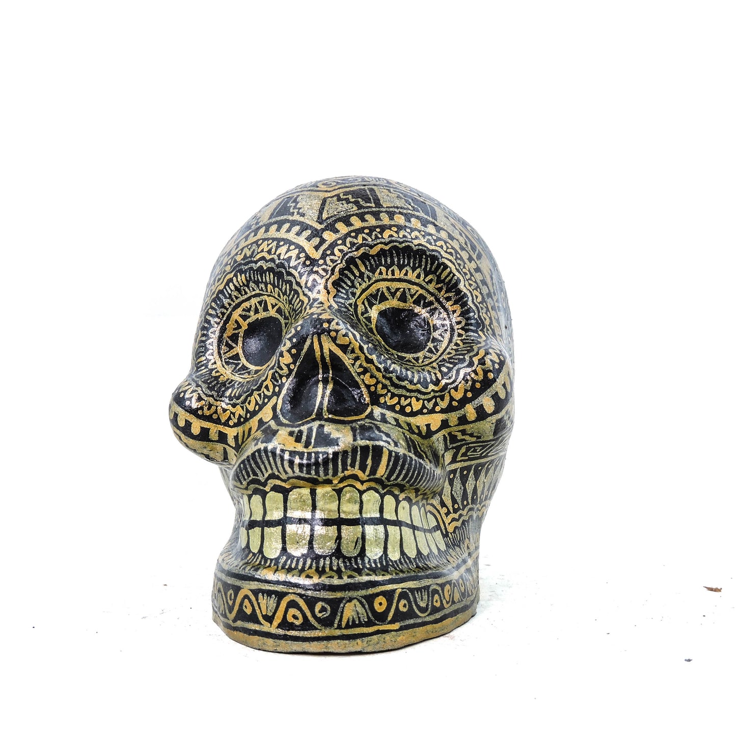 Craneo de Barro Dorado